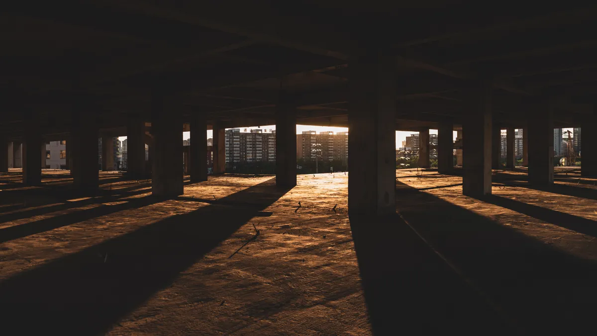 Empty crawl space under a building with columns